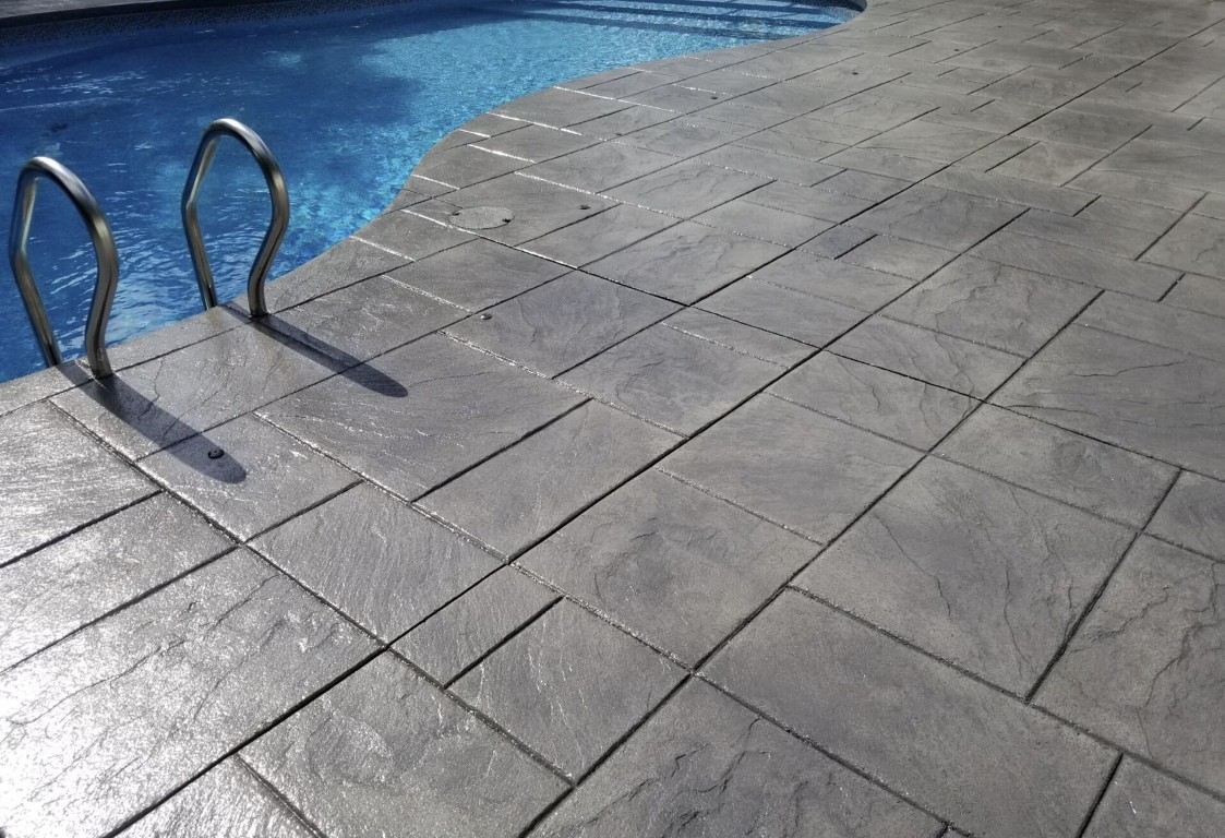 Stamped slate-pattern decorative concrete surface installed at a property in Little Rock, AR